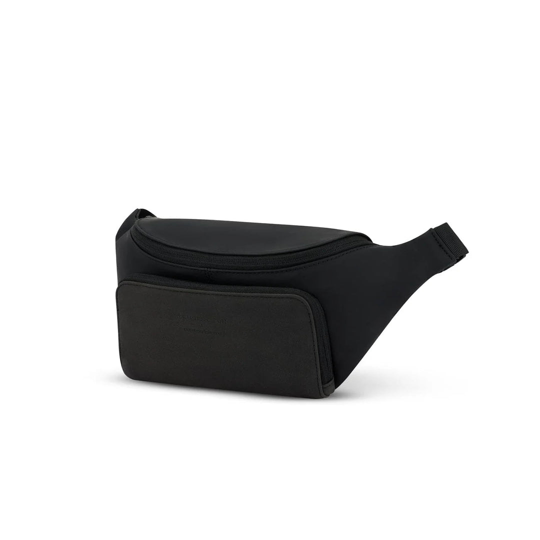 Three-quarter view of the black Bali crossbody showing the curved shape and front phone pocket