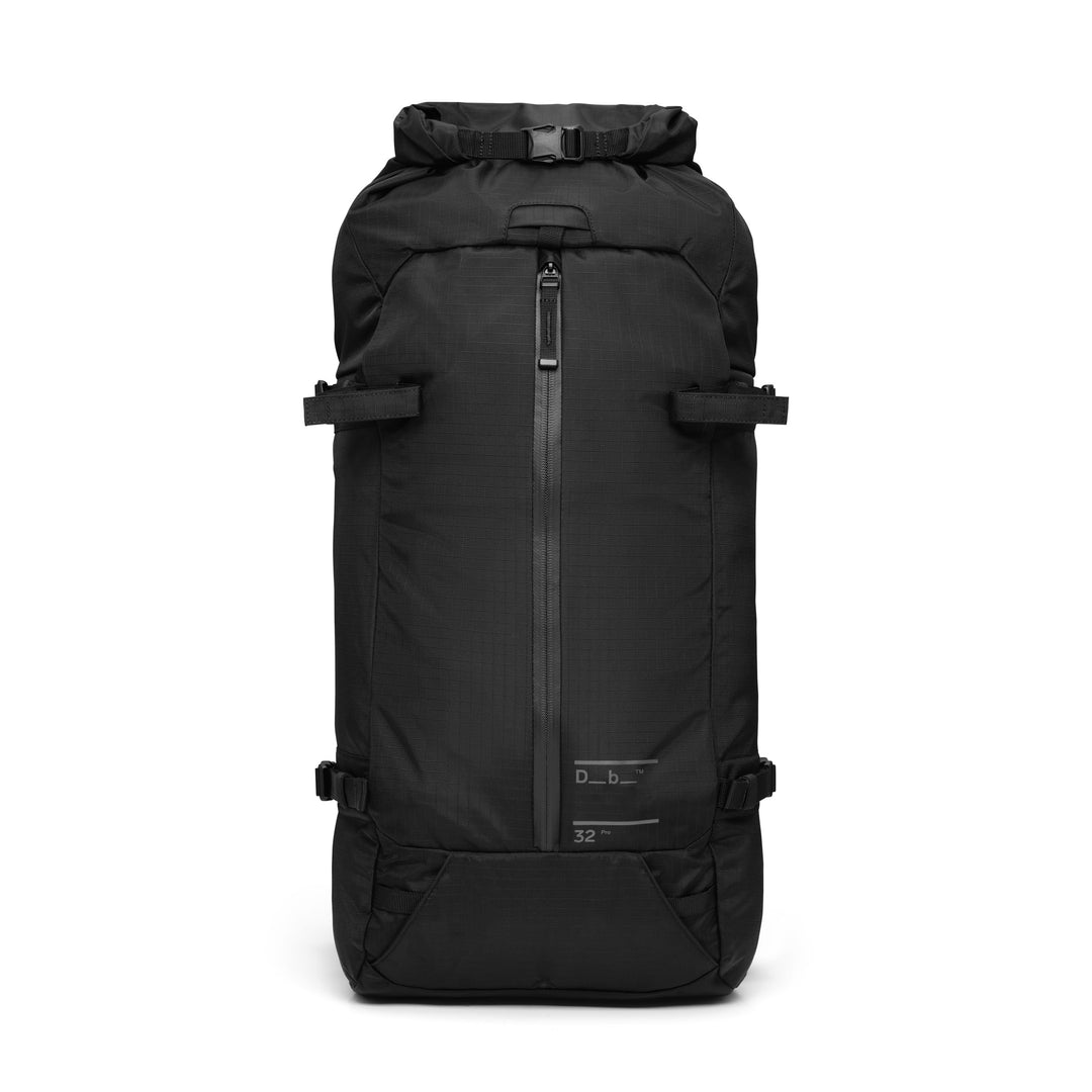 DB Journey Snow Pro Backpack 32L in Black, front view with the roll-top closure, vertical front zip and side carry straps