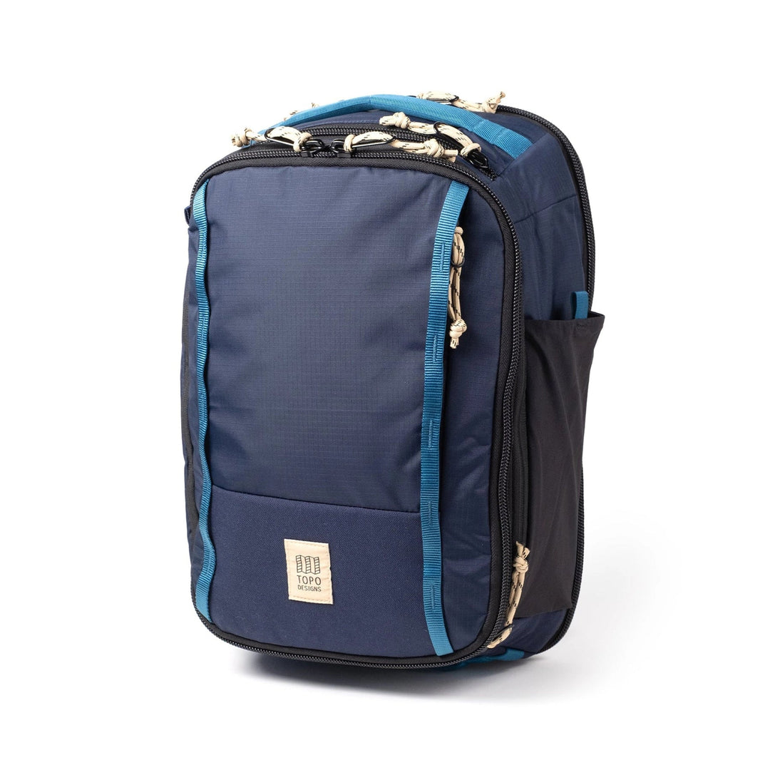 Side view of the Global Travel Backpack in navy and sahara