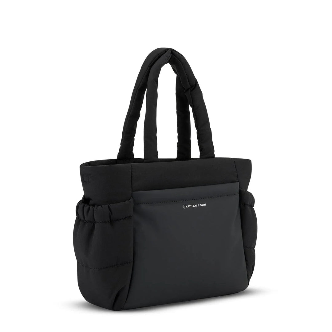 Side view with elastic-edged bottle holder and quilted puffer silhouette