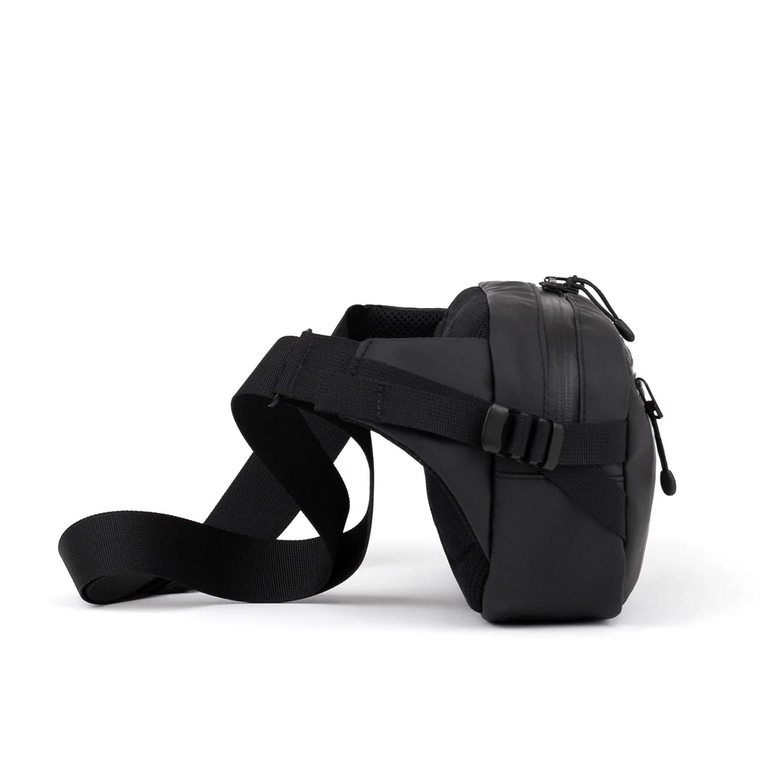 Side view showing adjustable strap and compact depth