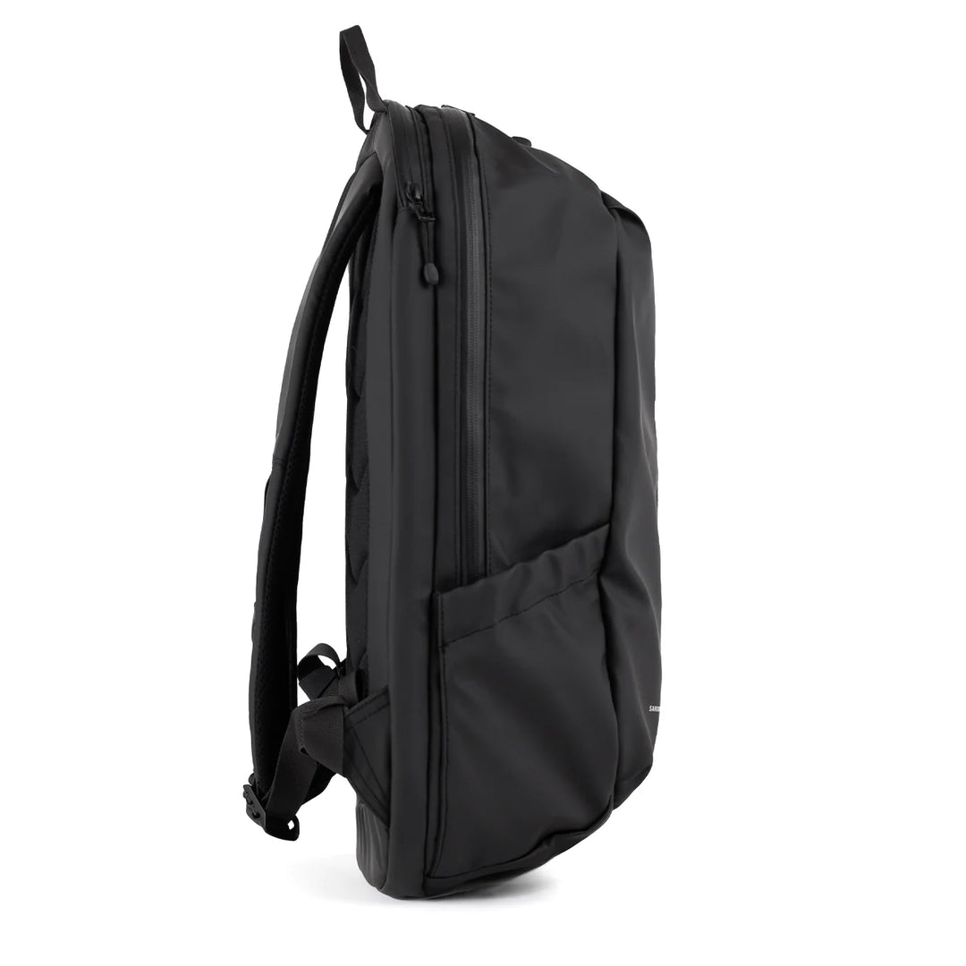 Side profile showing slim silhouette and side pocket
