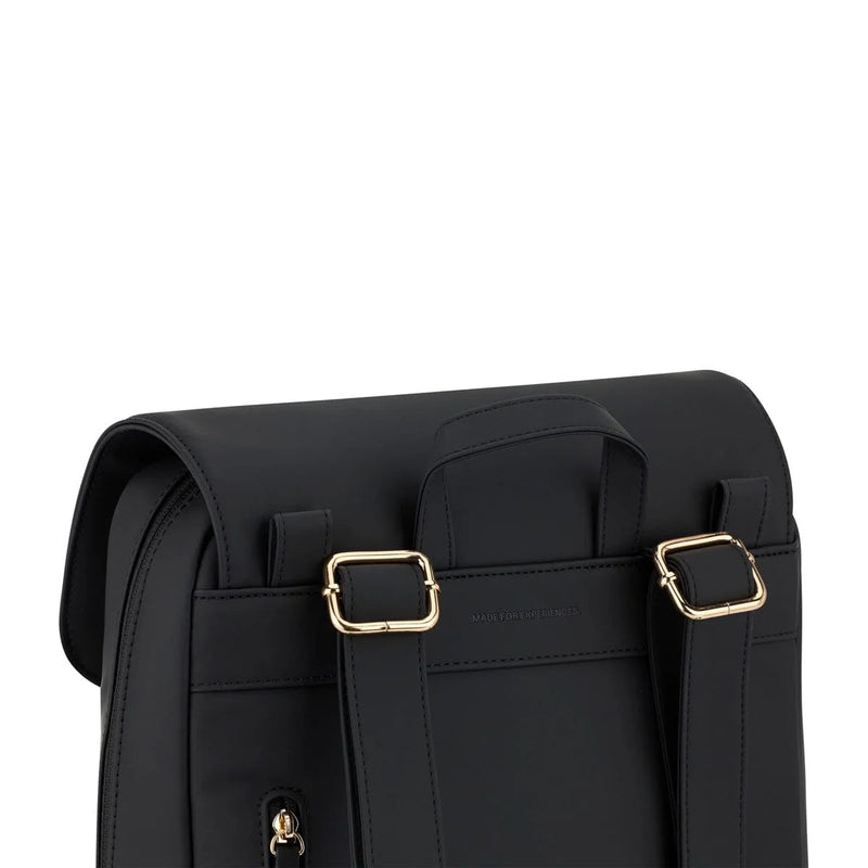 Gold strap adjusters at the top of the rear panel of the cream black Tromso backpack