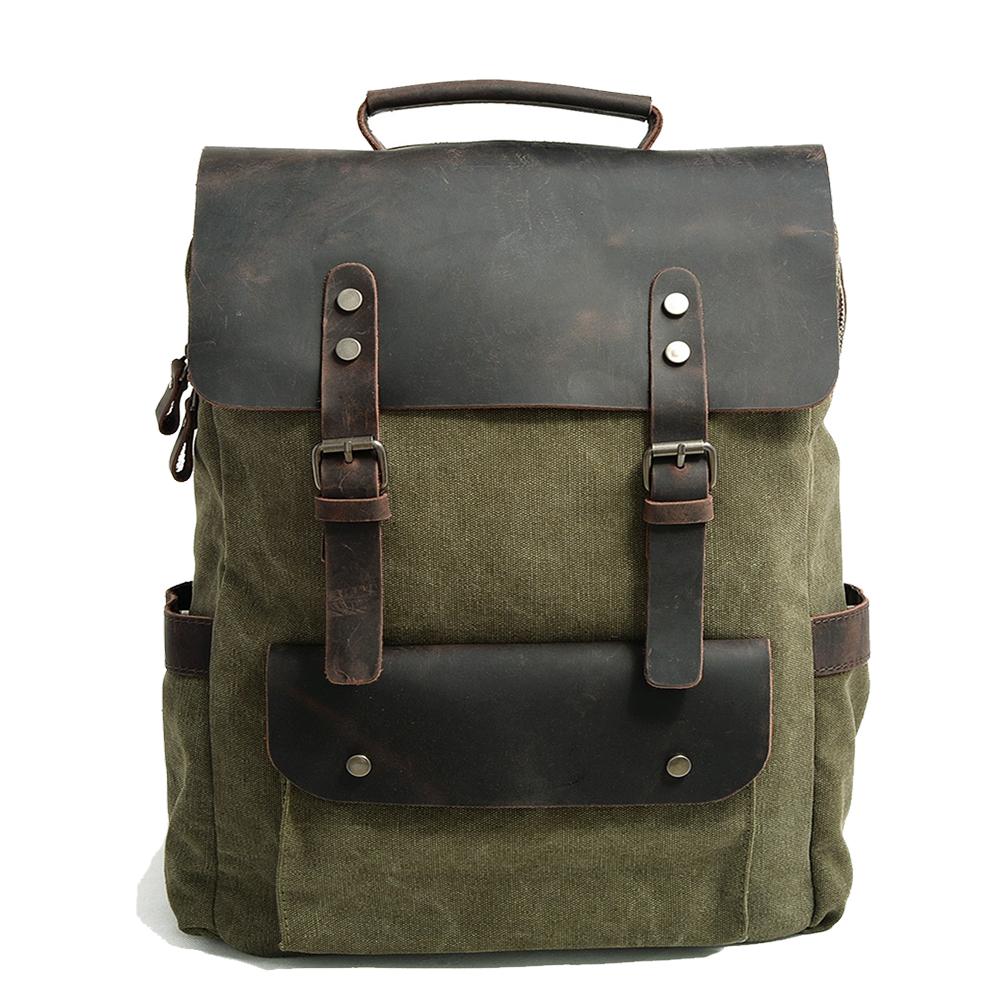 Canvas laptop backpack in olive light green with full-grain leather flap and metal buckle straps — Helsinki