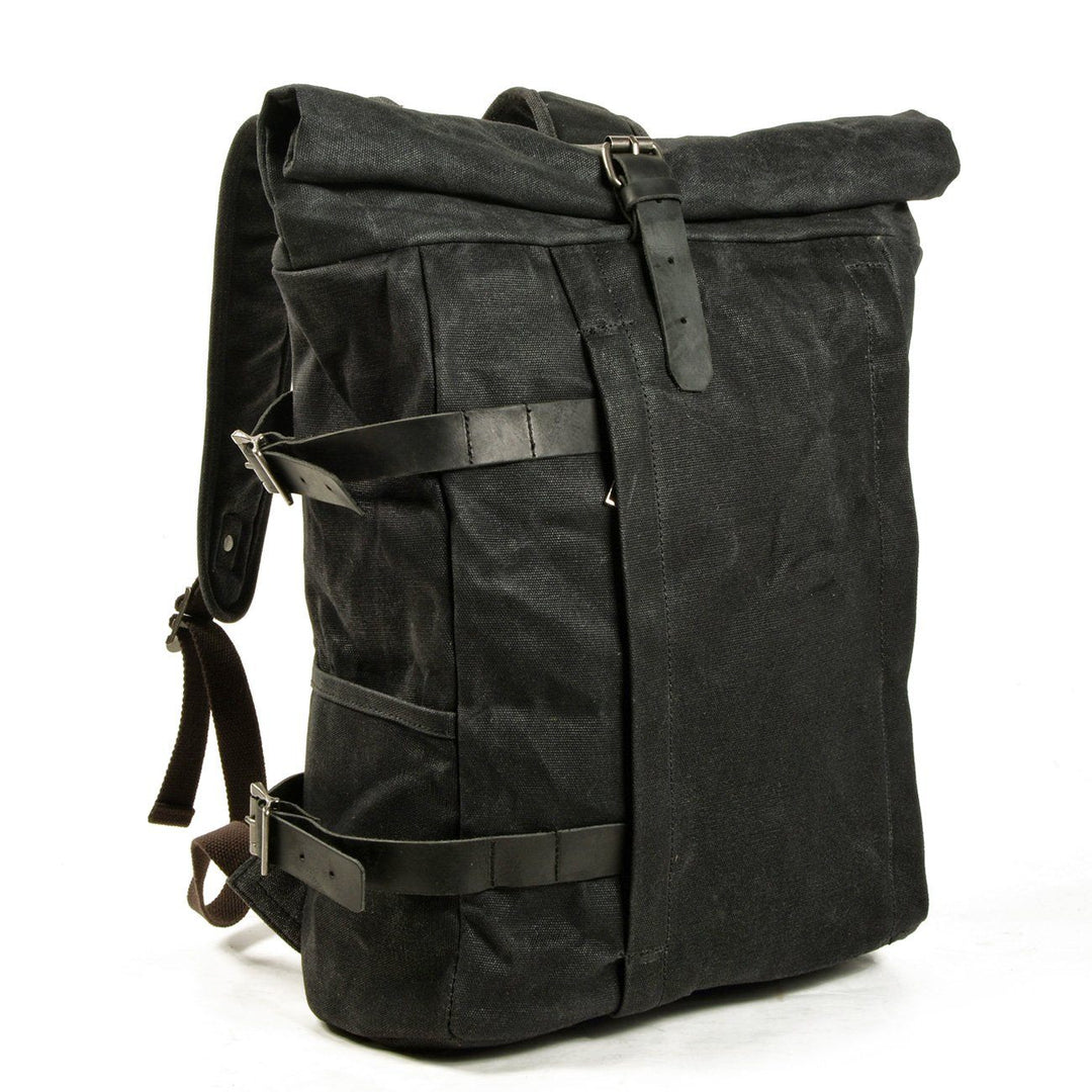 Detail of the Gstaad vintage motorcycle backpack leather flap and brass buckle on the rucksack