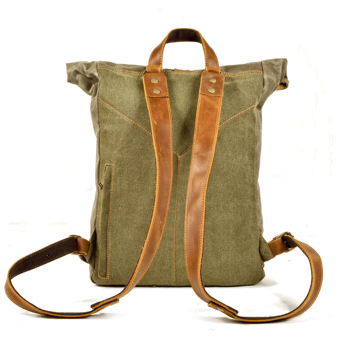 Back panel of the army green Hanover waxed canvas rucksack with full-grain leather shoulder straps and reinforced anchor