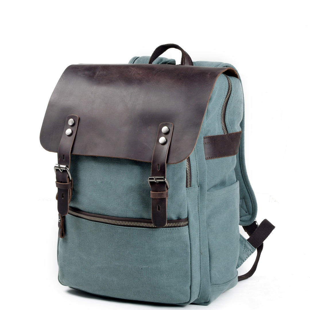 Lightweight cloth backpack silhouette in compact urban size with cotton body and leather flap on the Milan