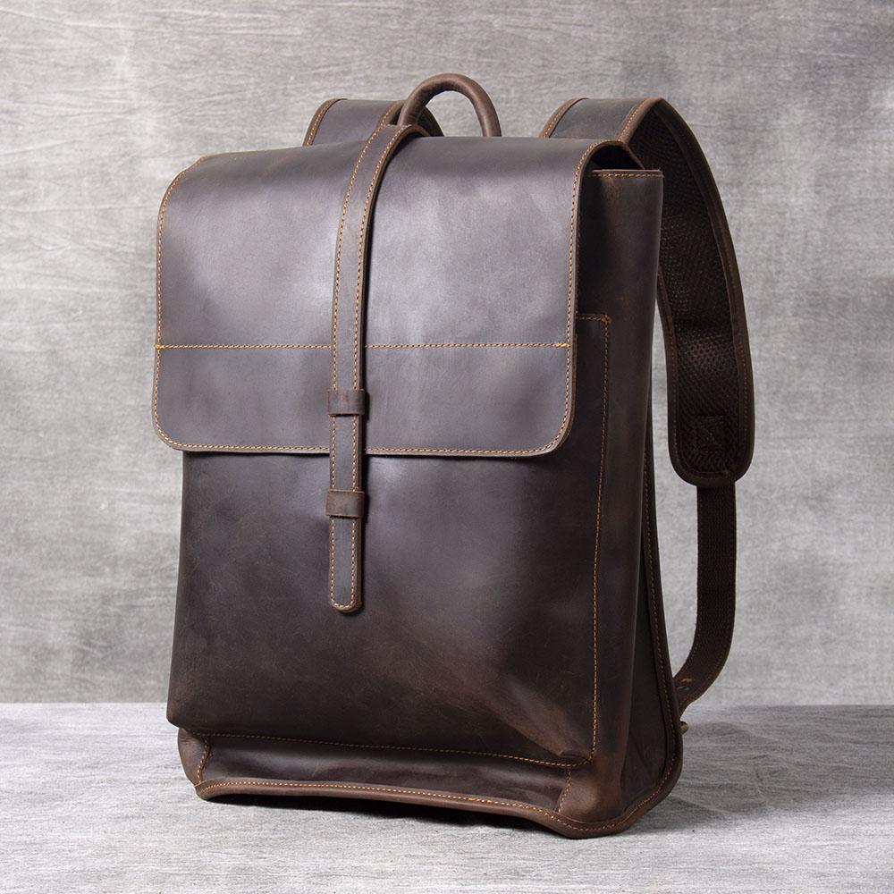 Sleek full-grain leather backpack with vintage flap closure