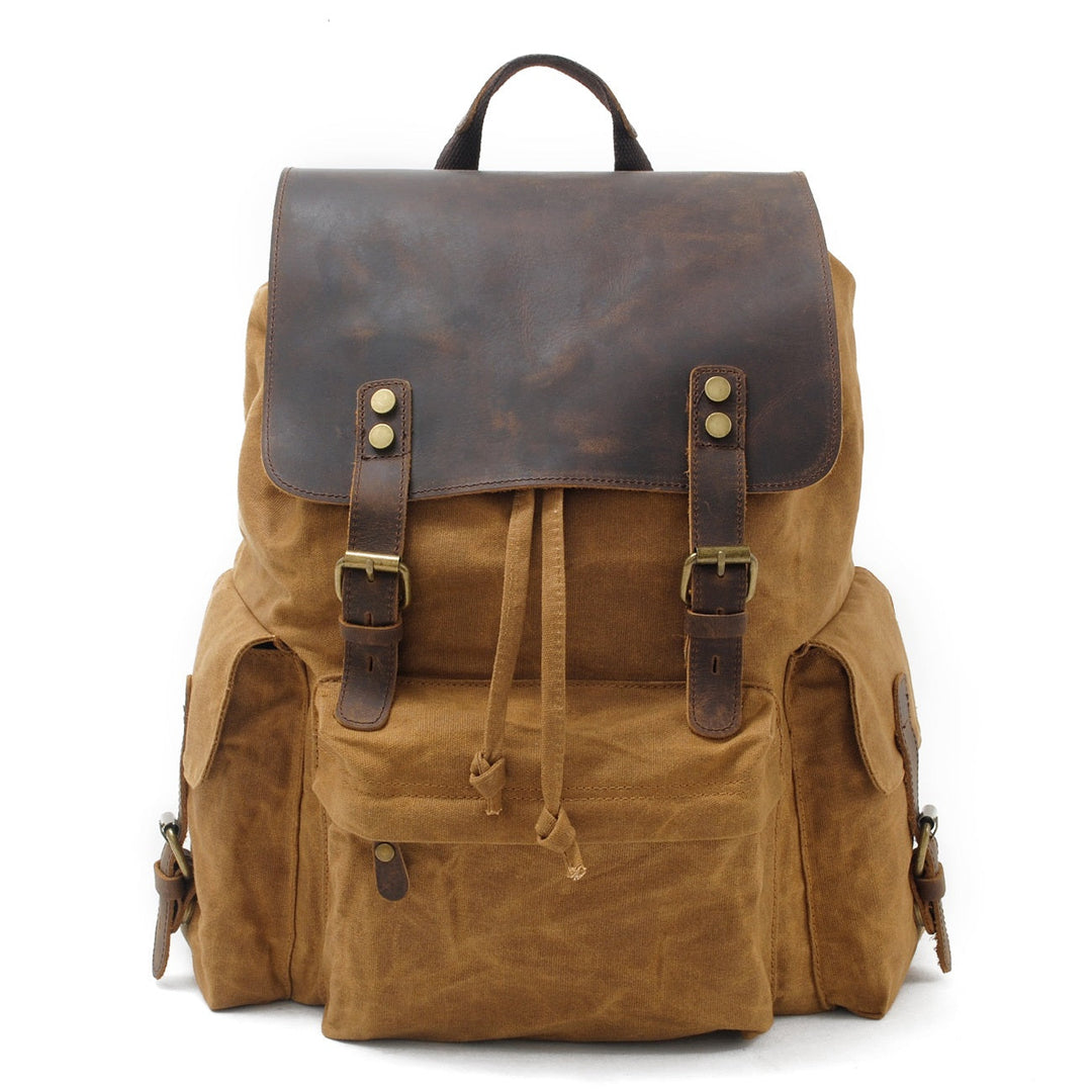 Waxed canvas backpack in khaki tan with crazy horse leather flap, twin leather strap closures and brass buckles, Eiken Latvia model