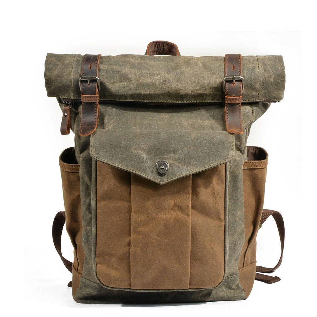 Waxed canvas roll top backpack in olive army green with crazy horse leather strap closures and antiqued brass hardware — Lund